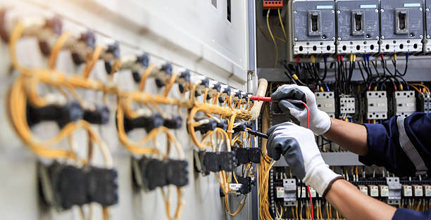 Professional Electrician technician working in Lake Success, NY